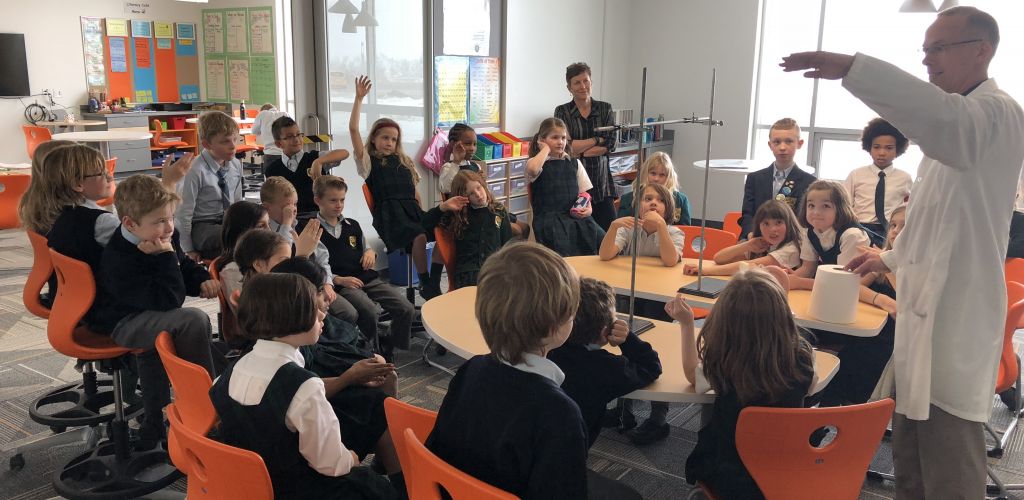 Grade 3 students use different tools to experiment with hearing and sounds